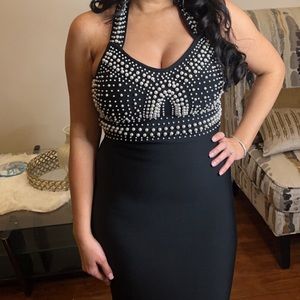Black halter midi bandage dress with pearl details. Size M